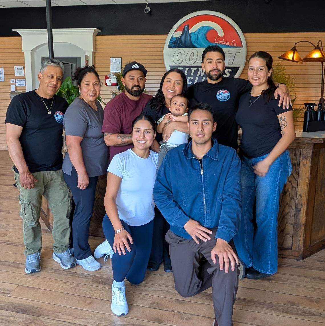Pablo Favila Jr., new owner of Cambria’s new Coast Fitness Club (second from right in the back), stands with his extended family, four of whom will be working with him at the gym that used to operate as Gym One. Also pictured, from left, are his parents Pablo and Eva Favila, Jorje Miranda, Jessica Favila and baby Aziel, and his girlfriend Alejandra Mendoza. Kneeling in front from left, are Samantha and Ivan Favila.